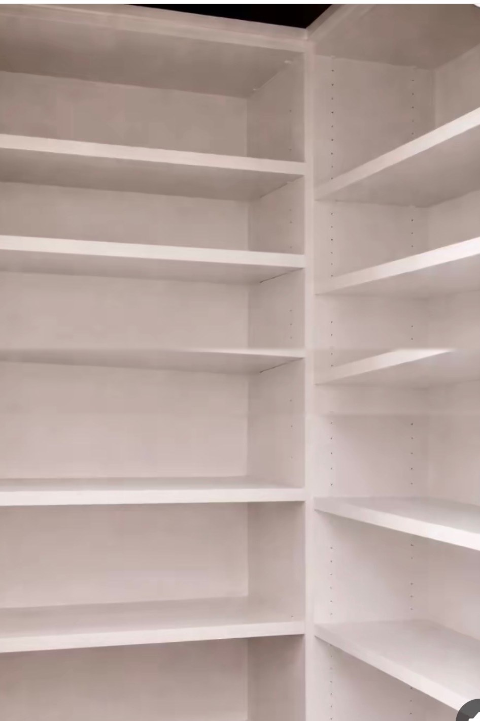 Butler's pantry before — empty white shelving